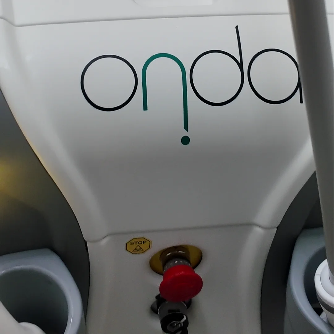The white ONDA device with its logo and a red emergency stop button